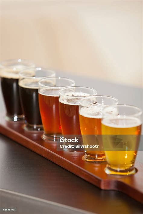 Row Of Beer Tasters Lined Up In A Brewpub Stock Photo Download Image