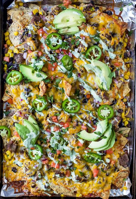 The Ultimate Cheesy Sheet Pan Steak Nachos Steak Nachos Nachos Recipe Nachos Recipe Beef