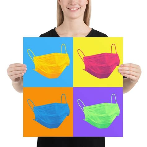 a woman in black shirt and face mask holding up four different colored ...