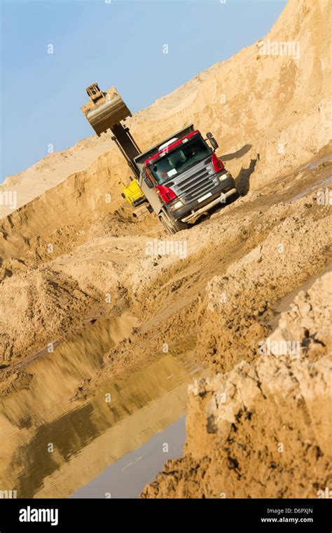 Excavator Loading Dumper Truck Stock Photo Alamy