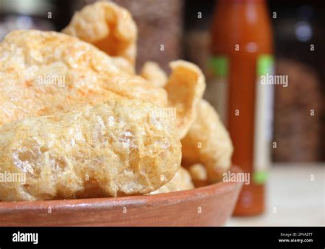 Fried Pork Skins With Hot Sauce In Rustic Kitchen Stock Photo Alamy