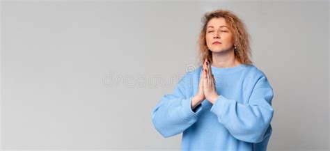 Grateful Hopeful Middle Age Woman Stands In Meditative Pose Enjoys