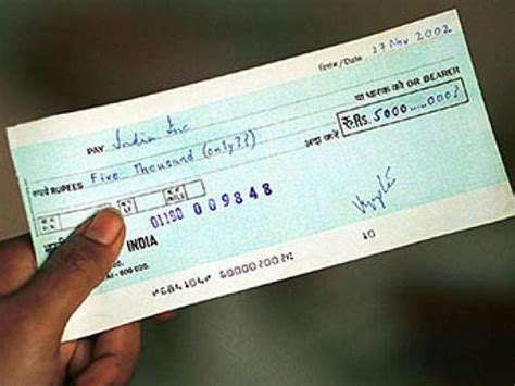 Wont Ban Cheque Books Says Finmin Oneindia News