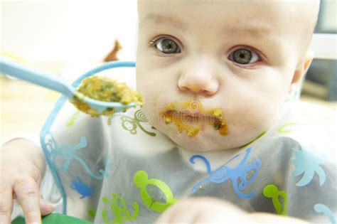 Messy Baby Being Fed Stock Image Image 12021291