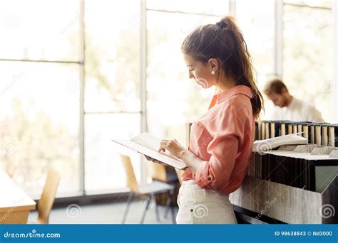 Beautiful Woman Reading A Book In A Library Stock Image Image Of