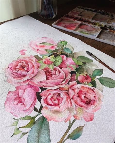 A Painting Of Pink Roses On Paper With Watercolor Pencils In The Foreground