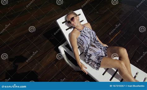 Woman Lie On A Sunbed In Sunglasses And A Boho Silk Shawl Girl Rest On