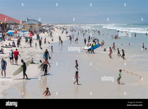 Crowds Of People On Muizenberg Beach In Cape Town South Africa Stock