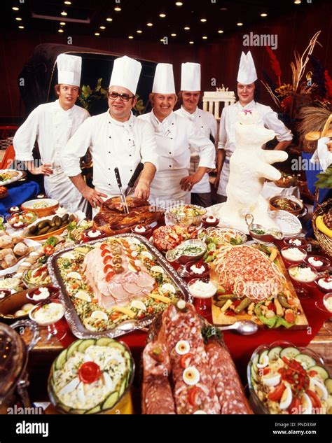 1980s Five Smiling Chefs Standing Behind Immense Buffet Of Meat And