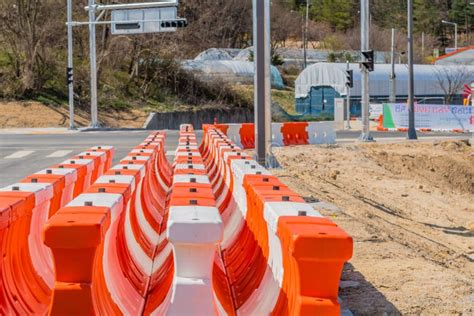 White and Orange Plastic Traffic Barriers Editorial Stock Image - Image ...