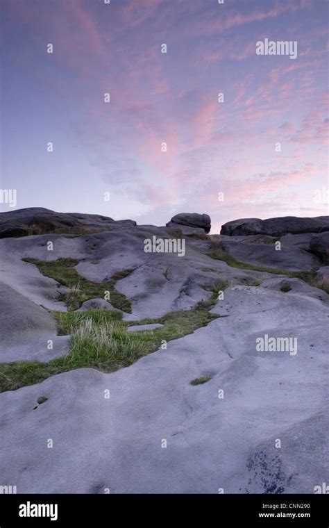 Gritstone rocks at twilight, Almscliff Crag rock formation, North Rigton, North Yorkshire ...