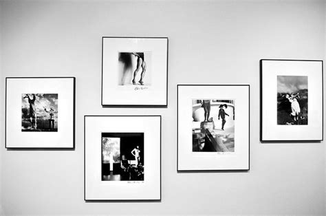 Four Black And White Photographs Hanging On The Wall