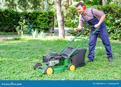 Man Portrait Mowing The Lawn With Lawnmower Stock Photo Image Of