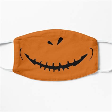 An Orange Face Mask With Black Teeth On It