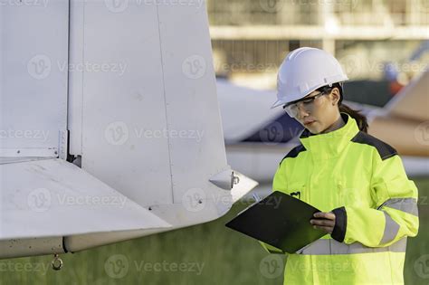 Technician fixing the engine of the airplane,Female aerospace ...