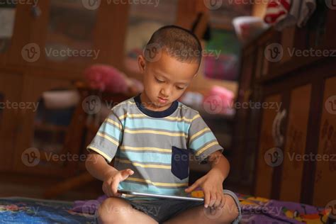 boy playing games on computer 22810428 Stock Photo at Vecteezy