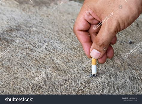 Hand Putting Out Cigarettecigarette Butt On Stock Photo