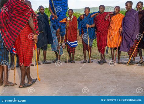 Group Of Massai People Participating A Traditional Dance With High