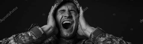 Monochrome Photo Of Stressed Soldier In Uniform And Cap Screaming While