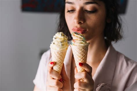 Free Photo Beautiful Young Woman Looking At Two Ice Cream Cones