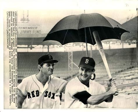 Ken Hawk Harrelson Holding An Umbrella Over Outfielder Carl Yastrzemski