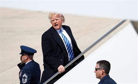 Photos Of Windy Trump Hair By Air Force One | The Daily Caller