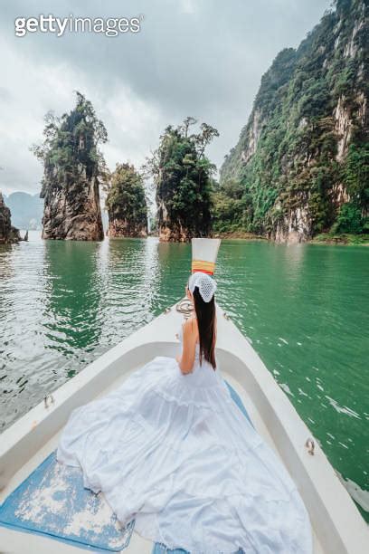 Female Tourists Take A Long Tailed Boat To Visit Khao Sok National Park