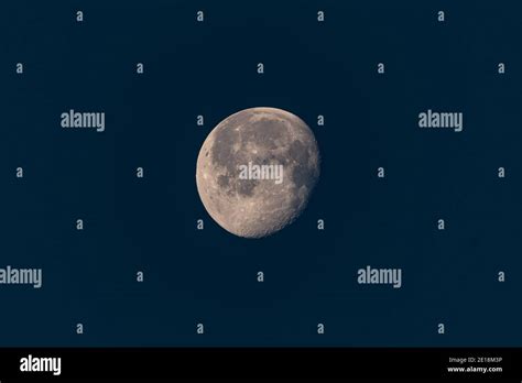 Growing phase moon in dark sky Stock Photo - Alamy