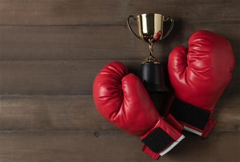 Premium Photo High Angle View Of Boxing Gloves And Trophy On Table