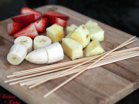 Chocolate Drizzled Fruit Kabobs Gathered In The Kitchen