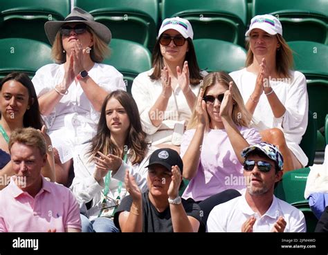 Katie Boulter (centre, right) watching Alex de Minaur on day eight of ...