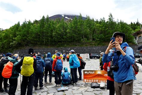 In Japan, Mount Fuji hiking season begins with new crowd control ...