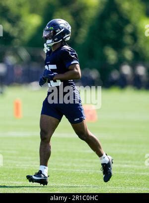 Seattle Seahawks Running Back Kenny Mcintosh Holds A Football