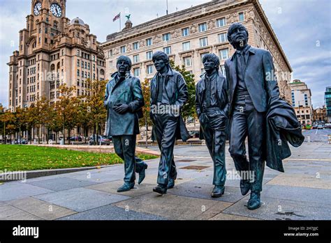 Bronze Statue Of The Beatles At Pier Head In Liverpool Stock Photo Alamy