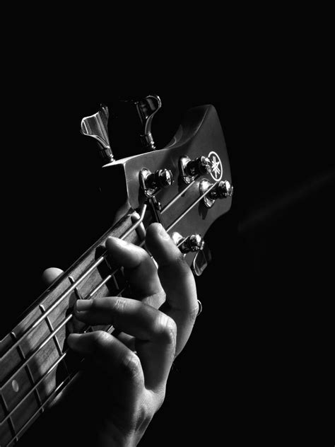 Download Beautiful Bass Guitar Strummed By A Professional Musician Wallpaper