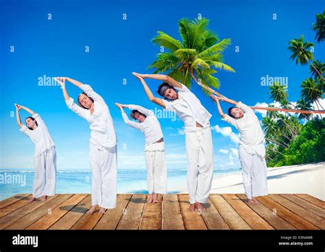 Group of People Doing Yoga on Beach Stock Photo - Alamy