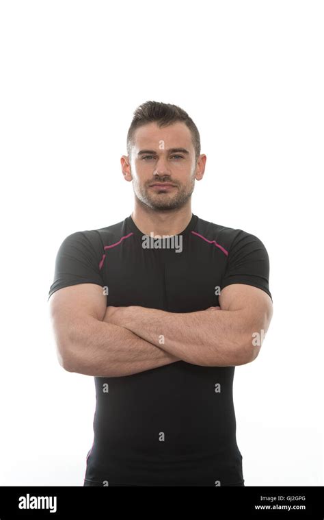 Handsome Personal Trainer Wearing Sportswear Isolated On A White