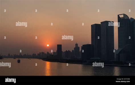 Dramatic View Of The Huangpu River And Pudong Skyline At Sunrise