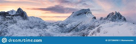 Panorama Of Sunrise Over Snowy Mountain Range With Colorful Sky In