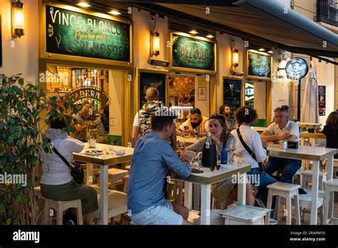 People enjoying nightlife in the historic centre of Malaga, Spain Stock ...