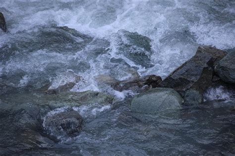 Premium Photo A River With Rocks And Water In It