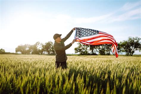 Premium Photo Man Hold Waving American Usa Flag Patriot Raise