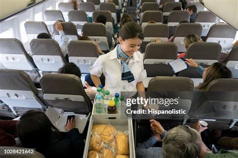 Air Hostess Serving Food And Drinks Onboard High Res Stock Photo