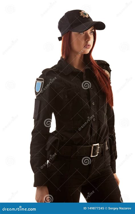 Redheaded Female Police Officer Is Posing For The Camera Isolated On