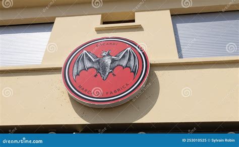 Bacardi Rum Brand Round Logo And Text Sign Red Bat On Wall Building