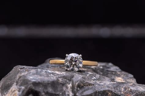 Premium Photo | Engagement diamond ring on black stone