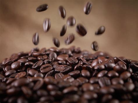 Close Up Of Coffee Beans Falling In Heap Photograph By Adam Gault