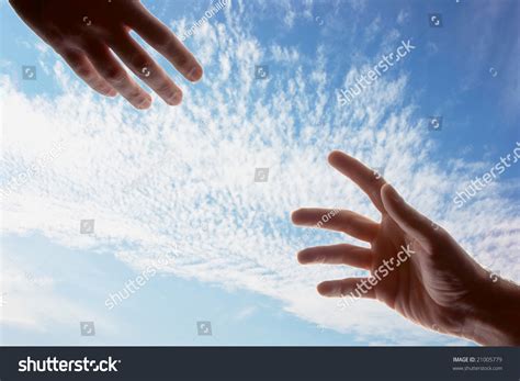 Two Male Hands With Fingers Outstretched Reaching Out Toward Each Other