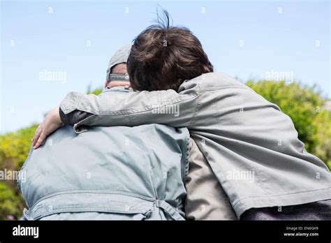 Father and son hugging Stock Photo - Alamy