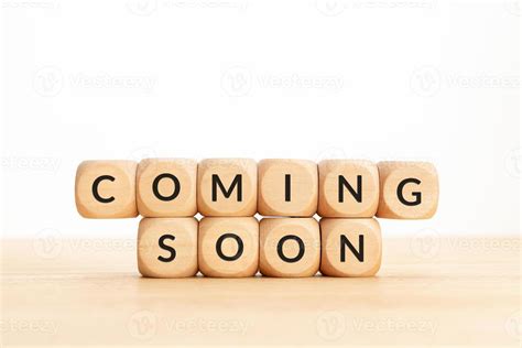 Coming soon phrase on wooden blocks 16106709 Stock Photo at Vecteezy